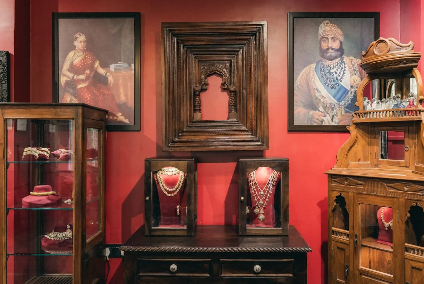 Inside the Shrivatsa store: red walls, framed portraits and jewellery display cabinets