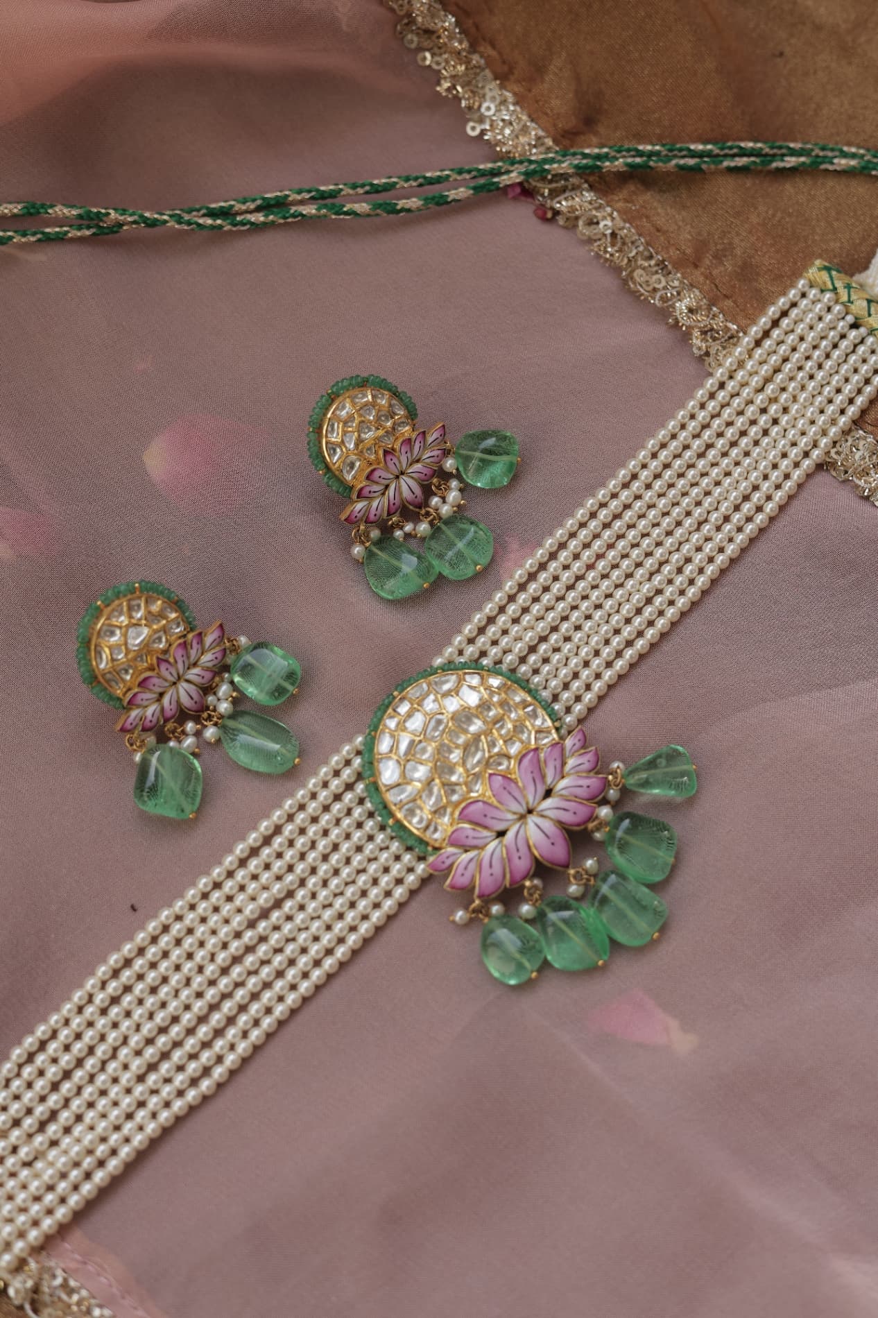 Meenakari enamel work on reverse of jadau jewellery — hand-painted floral pattern